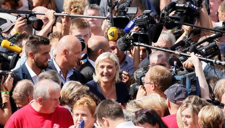 Marine Le Pen, French National Front (FN) political party leader and a member of the European Parliament, leaves after attending a FN political rally in Brachay, France, September 3, 2016. REUTERS/Gonzalo Fuentes