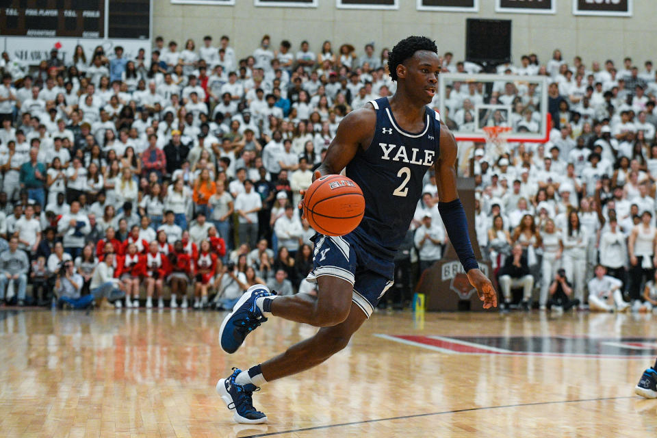 PROVIDENCE, RI - MARCH 04: Yale Bulldogs guard Bez Mbeng (2) dribbles the ball during a college basketball game between the Yale Bulldogs and the Brown Bears on March 4, 2023, at the Pizzitola Sports Center in Providence, RI. (Photo by Erica Denhoff/Icon Sportswire via Getty Images)