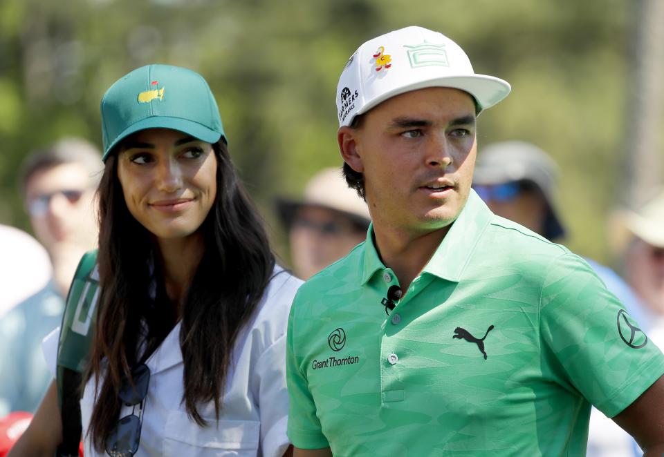 AUGUSTA, GEORGIA - APRIL 10: Rickie Fowler of the United States stands with fiancee Allison Stokke during the Par 3 Contest prior to the Masters at Augusta National Golf Club on April 10, 2019 in Augusta, Georgia. (Photo by Kevin C. Cox/Getty Images)