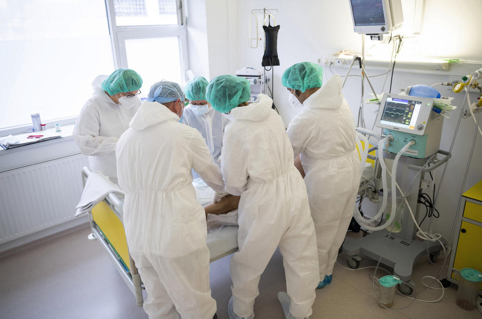 Doctors and nurses attend to a patient at the intensive care unit for COVID-19 patients in the Andras Josa hospital in Nyiregyhaza, Hungary, Thursday, Nov. 26, 2020 (Attila Balazs/MTI via AP).