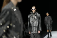 A model wears a creation as part of the men's Giorgio Armani Fall-Winter 2024-2025 collection, that was presented in Milan, Italy, Saturday, Jan. 13, 2024. (AP Photo/Luca Bruno).