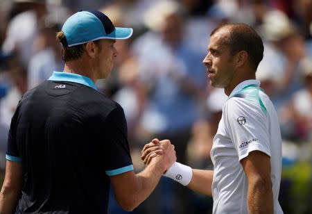 Tennis - Aegon Championships - Queen’s Club, London, Britain - June 23, 2017 Luxembourg's Gilles Muller shakes the hand of USA's Sam Querrey as he celebrates winning his quarter final match Action Images via Reuters/Tony O'Brien