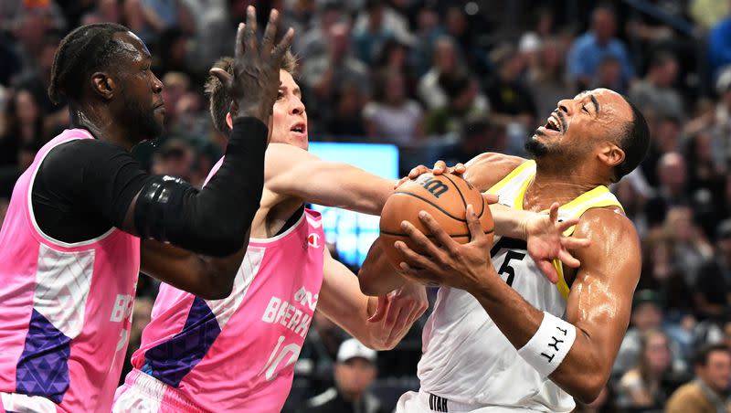 Utah Jazz guard Talen Horton-Tucker (5) is hit by New Zealand Breakers forward Tom Abercrombie (10) as he tries to drive the lane as the Jazz and the Breakers play at the Delta Center in Salt Lake City on Monday, Oct. 16, 2023.