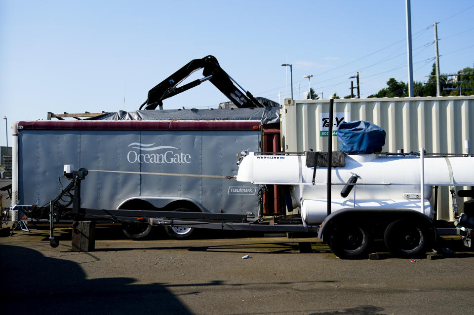 Equipment with the OceanGate logo is parked on a lot near the OceanGate offices Thursday, June 22, 2023, in Everett, Wash. The U.S. Coast Guard said Thursday that the missing submersible Titan imploded near the Titanic shipwreck site, killing everyone on board. (AP Photo/Lindsey Wasson)