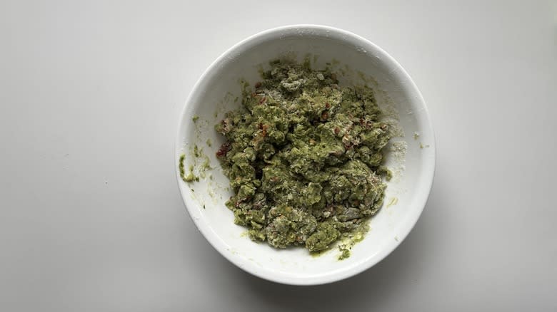 green dough in a white bowl