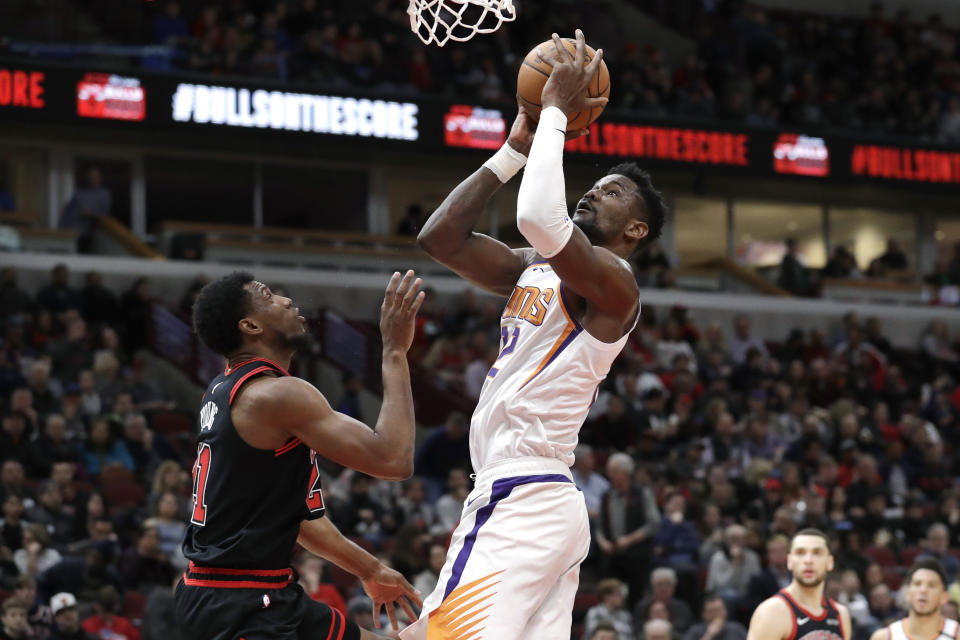 Phoenix Suns center Deandre Ayton shoots against Chicago Bulls forward Thaddeus Young during the second half of an NBA basketball game in Chicago, Saturday, Feb. 22, 2020. The Suns won 112-104. (AP Photo/Nam Y. Huh)