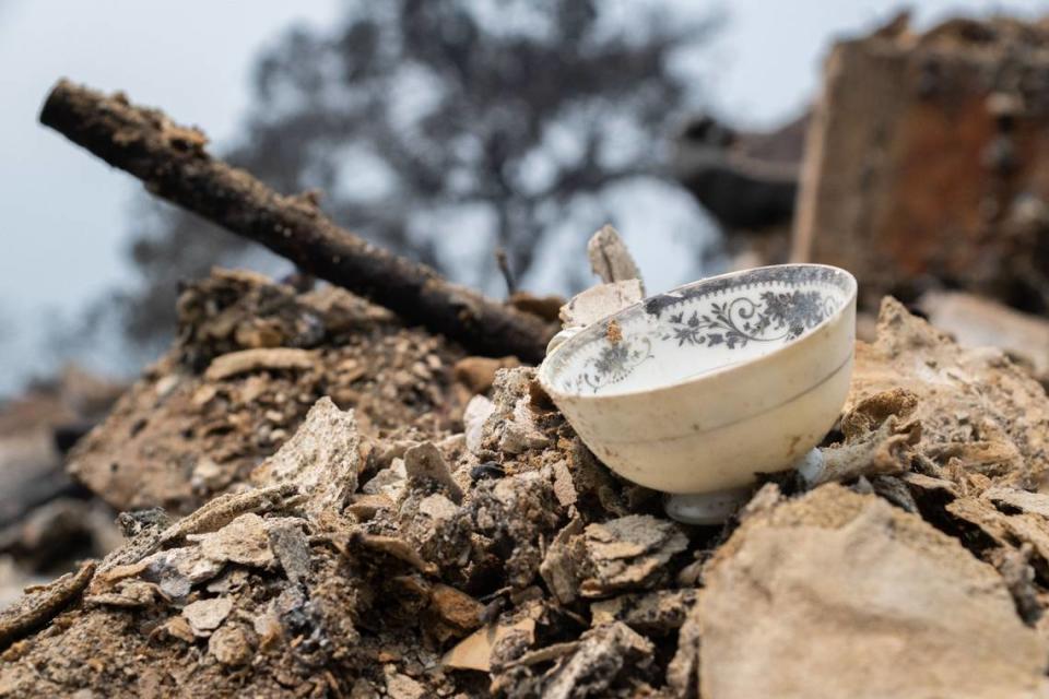 A teacup sits amidst the rubble of the Fischer home along Peregrine Road in Forest Ranch on Wednesday. “Just the stuff that passed down from generation to generation, and now it’s not—the buck, it stopped here,” Fischer said. “That’s what hurts the most.”