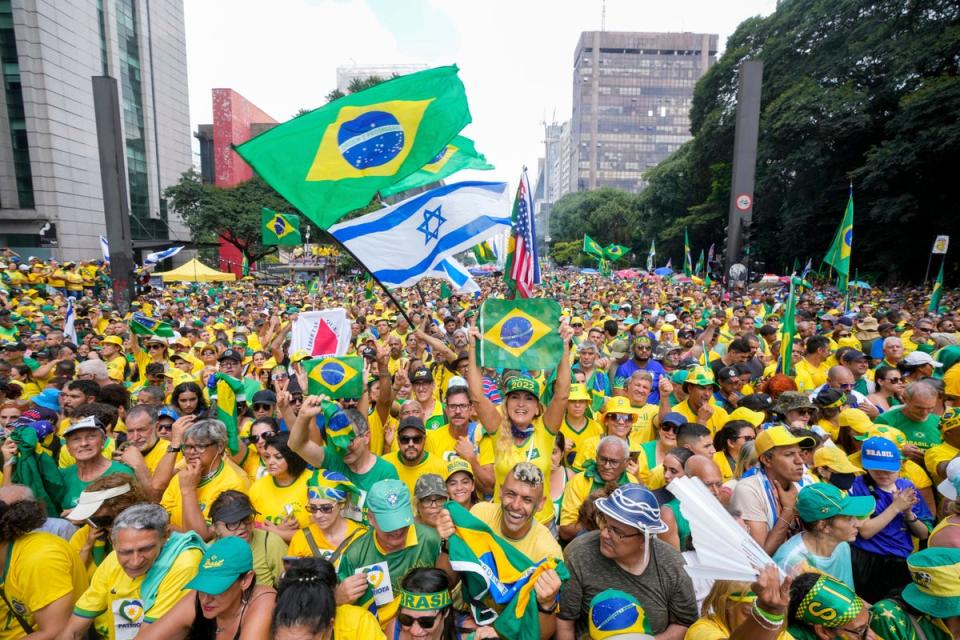 Supporters of Jair Bolsonaro thronged streets of Sao Pa ulo (AP)