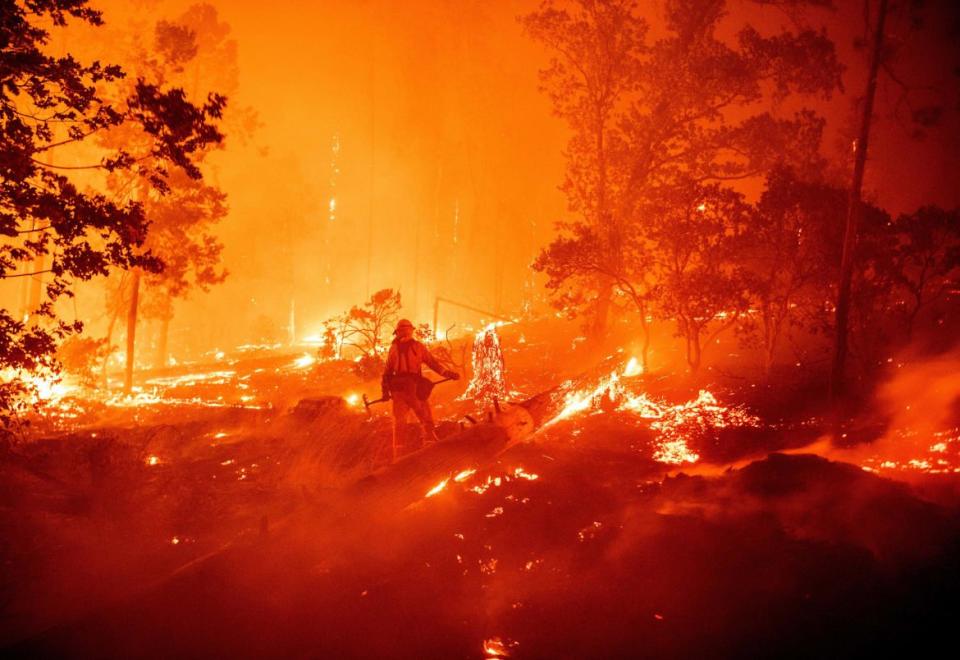 <div class="inline-image__caption"><p>A firefighter works the scene as flames push towards homes during the Creek fire in the Cascadel Woods area of California on Sept. 7, 2020. </p></div> <div class="inline-image__credit">Josh Edelson/Getty </div>