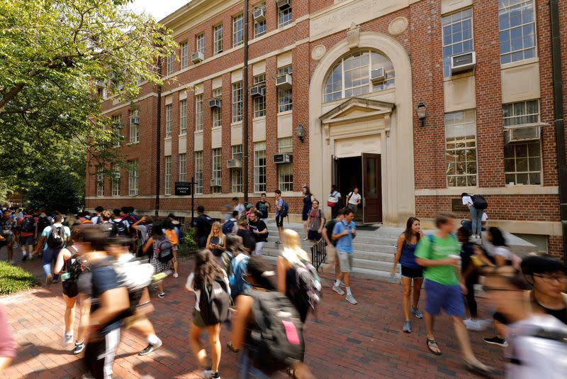 FILE PHOTO: Students walk past a classroom building on the campus of the University of North Carolina at Chapel Hill North Carolina