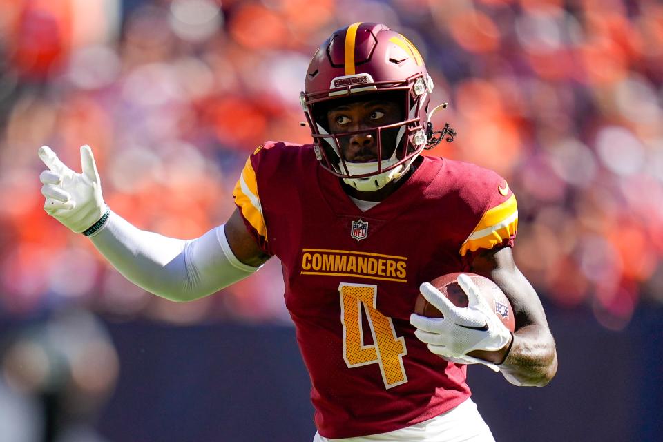 Washington Commanders wide receiver Curtis Samuel (4) runs against the Denver Broncos during an NFL football game Sunday, Sept. 10, 2023, in Denver. (AP Photo/Jack Dempsey)