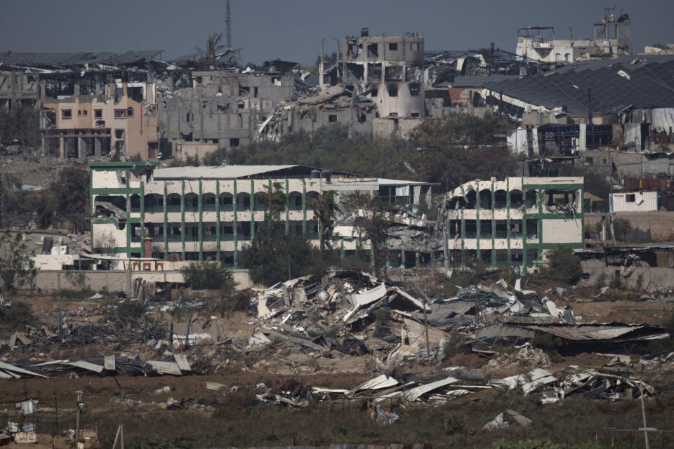 Destroyed farms and buildings in the Gaza Strip as seen from Southern Israel, Friday, Dec. 22, 2023. (AP Photo/Leo Correa)
