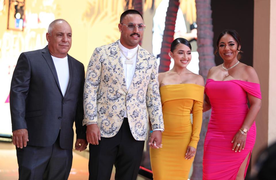Nestor Cortés Jr. arrives in a light patterned jacket with his and family at the 2022 MLB All-Star Game Red Carpet Show.