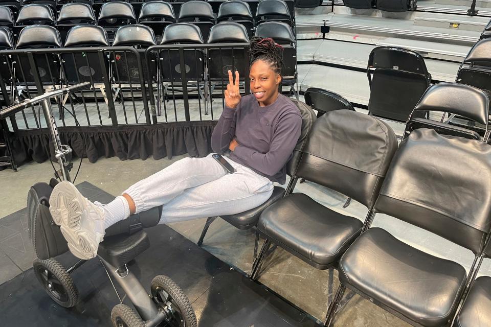 Las Vegas Aces WNBA basketball player Chelsea Gray wears a boot during a team availability at Barclays Center in New York Tuesday, Oct. 17, 2023. Gray is out at least for Game 4 of the WNBA Finals against the New York Liberty.