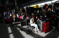 People wait with their luggage at Heathrow Terminal 5 in London, Britain May 27, 2017. REUTERS/Neil Hall