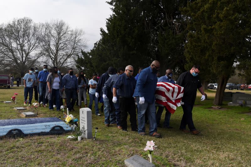 The Wider Image: 'I just ask God to help me': Texas funeral home crushed by death as U.S. COVID toll nears 500,000