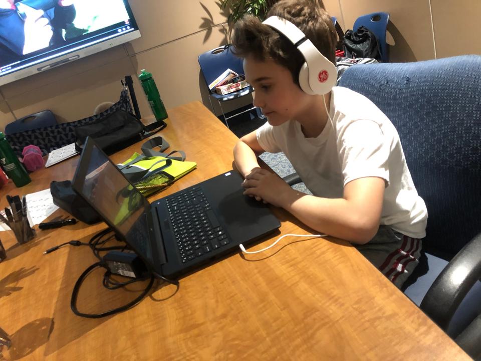 A boy participates in a virtual camp program for the YMCA of Youngstown, Ohio. Camp counselors say to keep kids connected to friends this summer.