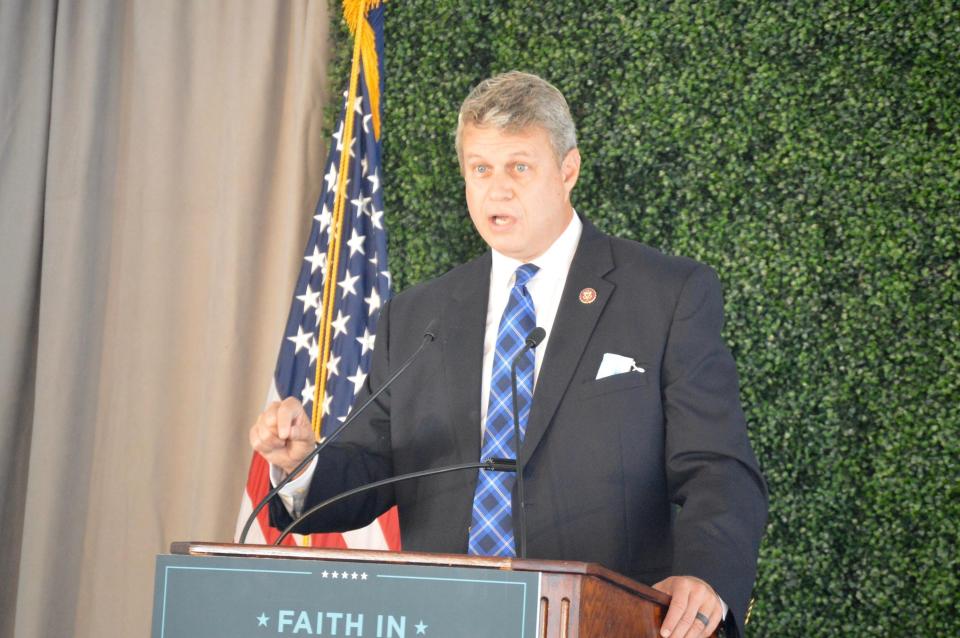 U.S. Rep. Bill Huizenga, R-Zeeland, speaks to a crowd of about 100 supporters at the Evangelicals for Trump rally Friday, Sept. 25, at Baker Lofts in Holland.