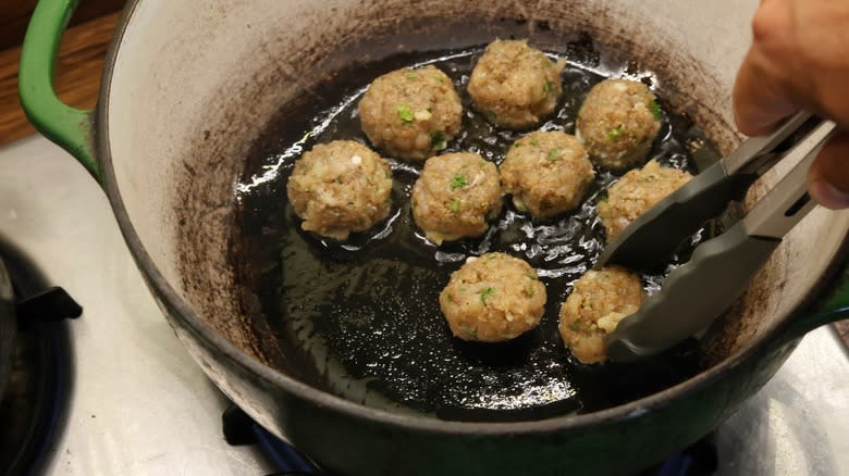 pot of frying meatballs