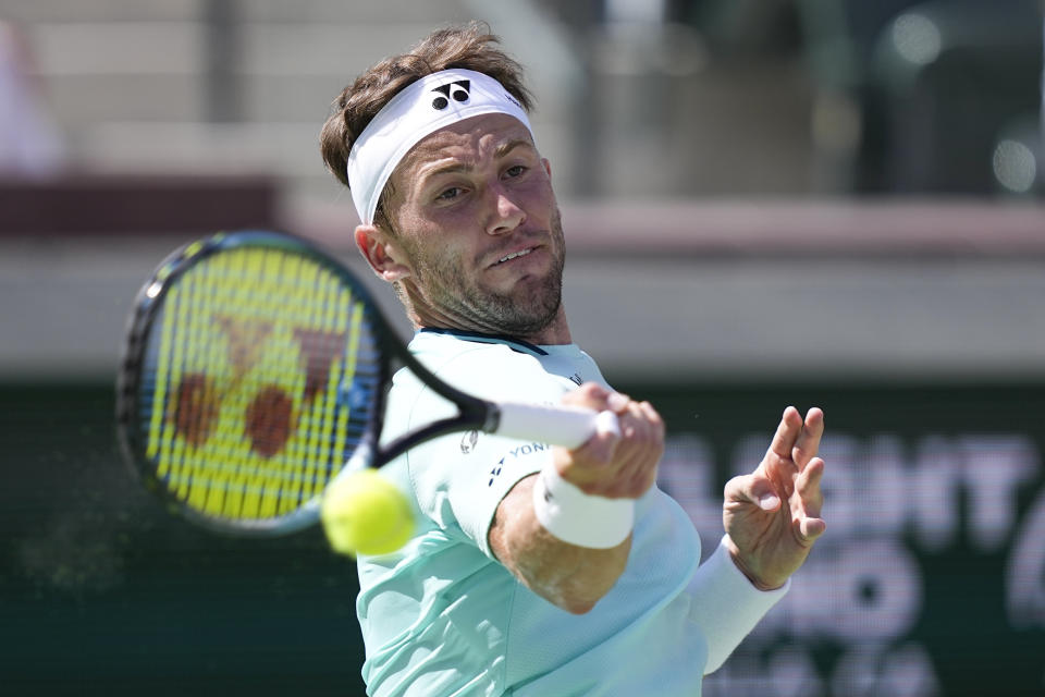 Casper Ruud, of Norway, returns to Gael Monfils, of France, at the BNP Paribas Open tennis tournament, Wednesday, March 13, 2024, in Indian Wells, Calif. (AP Photo/Mark J. Terrill)