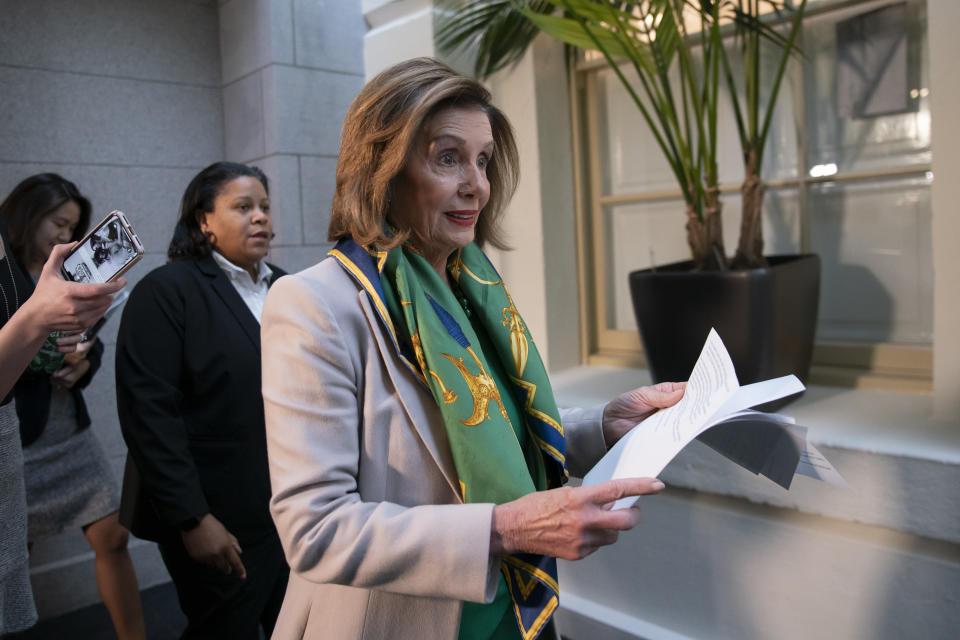 Speaker of the House Nancy Pelosi, D-Calif., arrives to meet with the Democratic Caucus at the Capitol in Washington, Tuesday, Jan. 14, 2020. Pelosi, who has not yet relayed the articles of impeachment to the Senate for the trial of President Donald Trump, has said she will discuss her next steps in that delayed process during her meeting today with fellow Democrats. Trump was impeached by the Democratic-led House last month on charges of abuse of power over pushing Ukraine to investigate Democratic rival Joe Biden and obstruction of Congress in the probe. (AP Photo/J. Scott Applewhite)