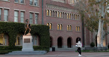 FILE PHOTO: A person walks by the Trojan Shrine at University of Southern California in Los Angeles, California, U.S., March 13, 2019. REUTERS/Mario Anzuoni - RC1EBEE9BE90/File Photo