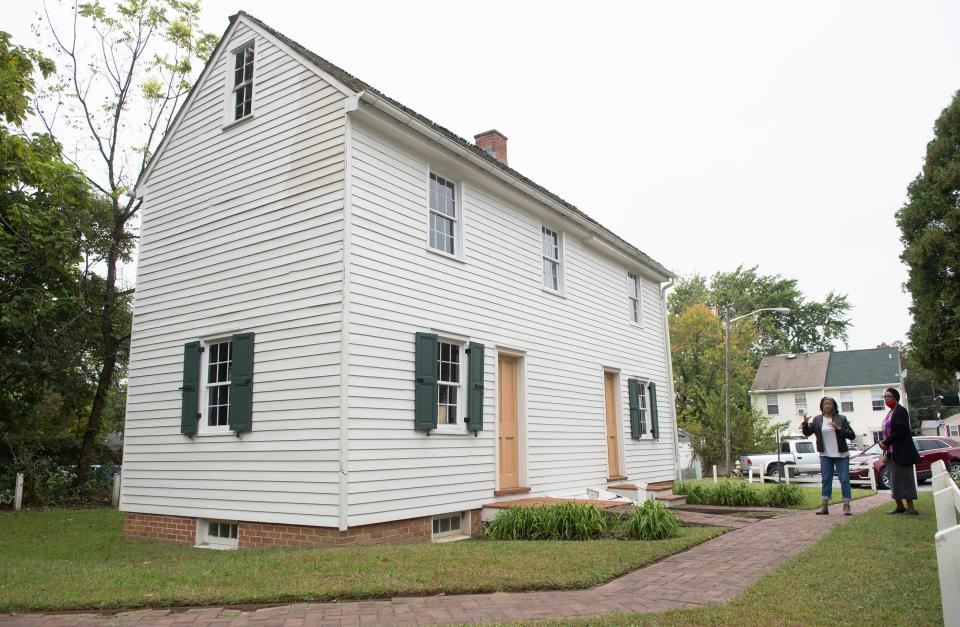 Linda Shockley, President of the Lawnside Historical Society, left, and Gloria Goodman,  Financial Secretary of the Lawnside Historical Society, stand by the Peter Mott House, a Lawnside historical site and a stop on the Underground Railroad that is in dire need of repairs. 