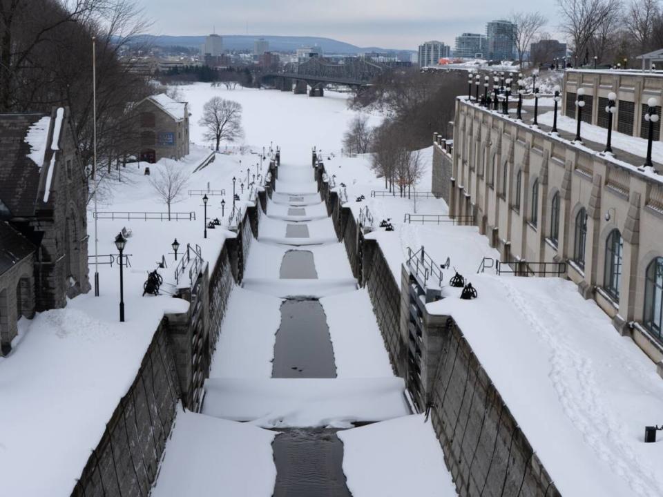 The Ottawa Locks on the Rideau Canal are seen covered with snow earlier this month. The first COVID update of spring 2023 saw some indicators dropping. (Jillian Renouf/CBC - image credit)