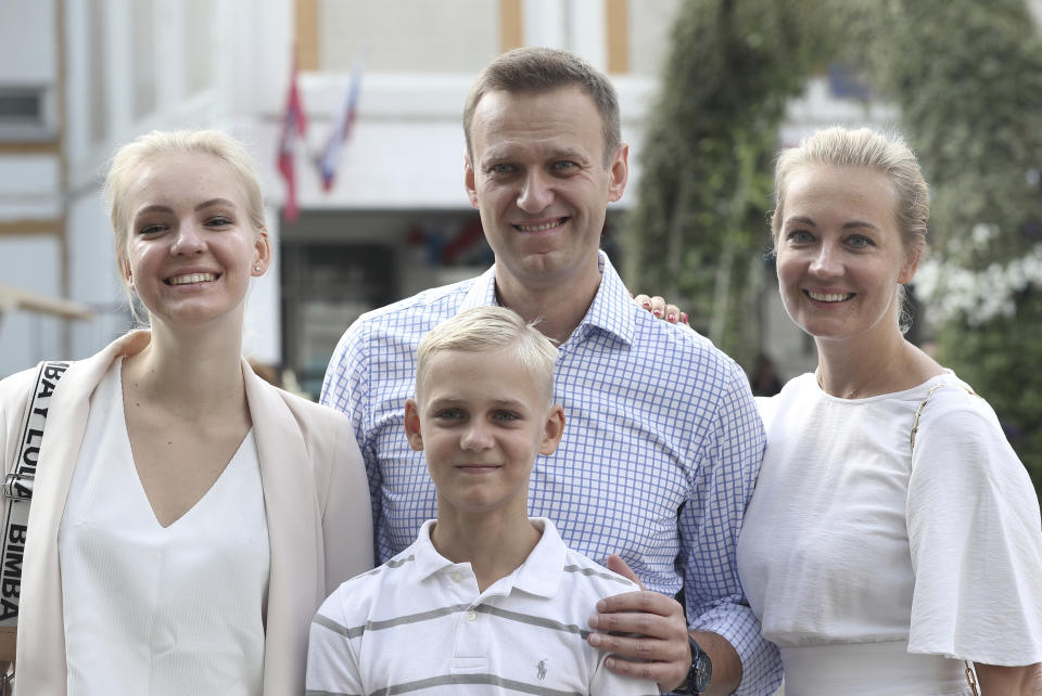 FILE - Russian opposition leader Alexei Navalny, with his wife Yulia, right, daughter Daria, and son Zakhar pose for media after voting during a city council election in Moscow, Russia, on Sept. 8, 2019. Navalny is due to hear the verdict Friday Aug. 4, 2023 in his latest trial on extremism charges. The prosecution has demanded a 20-year prison sentence, and the politician himself said he expects a lengthy prison term. (AP Photo, File)