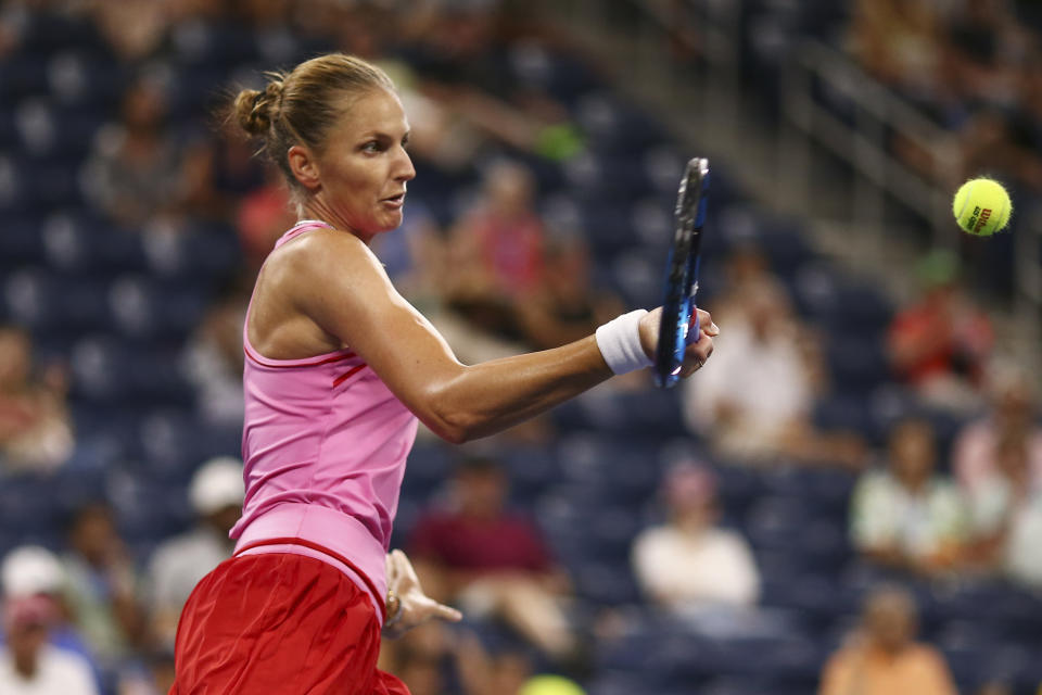 Karolina Pliskova, of the Czech Republic, returns a shot to Victoria Azarenka, of Belarus, during the fourth round of the U.S. Open tennis championships, Monday, Sept. 5, 2022, in New York. (AP Photo/Andres Kudacki)