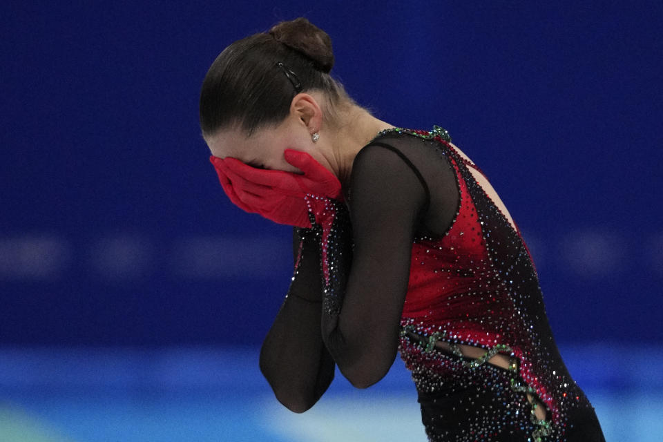 Kamila Valieva, of the Russian Olympic Committee, reacts after the women's free skate program during the figure skating competition at the 2022 Winter Olympics, Thursday, Feb. 17, 2022, in Beijing. (AP Photo/Bernat Armangue)