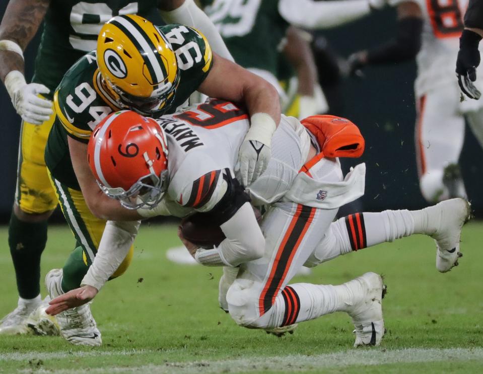 Green Bay Packers defensive end Dean Lowry (94) sacks Cleveland Browns quarterback Baker Mayfield (6) during the fourth quarter of their game Saturday, December 25, 2021 at Lambeau Field in Green Bay, Wis.
