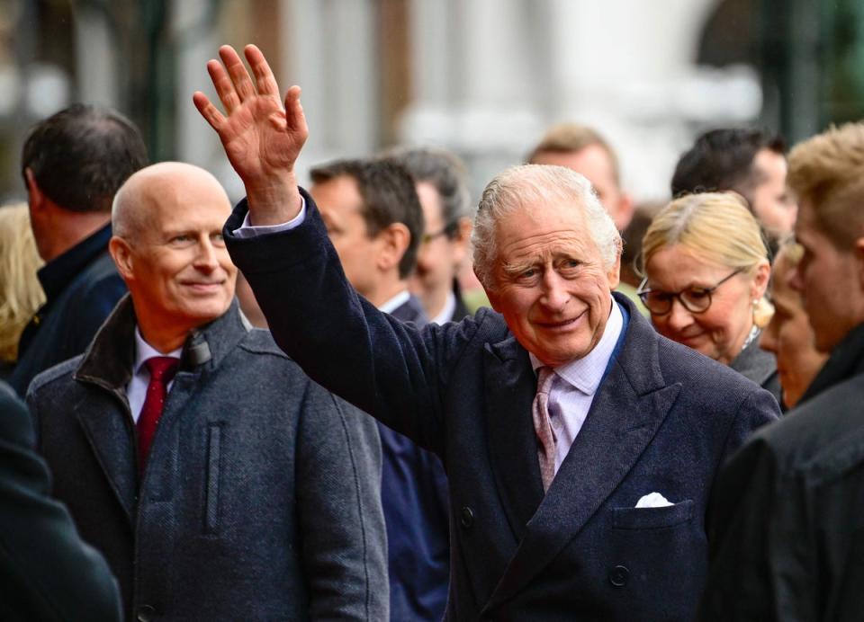 King Charles waves to wellwishers outside Hamburg’s town hall (AFP via Getty Images)