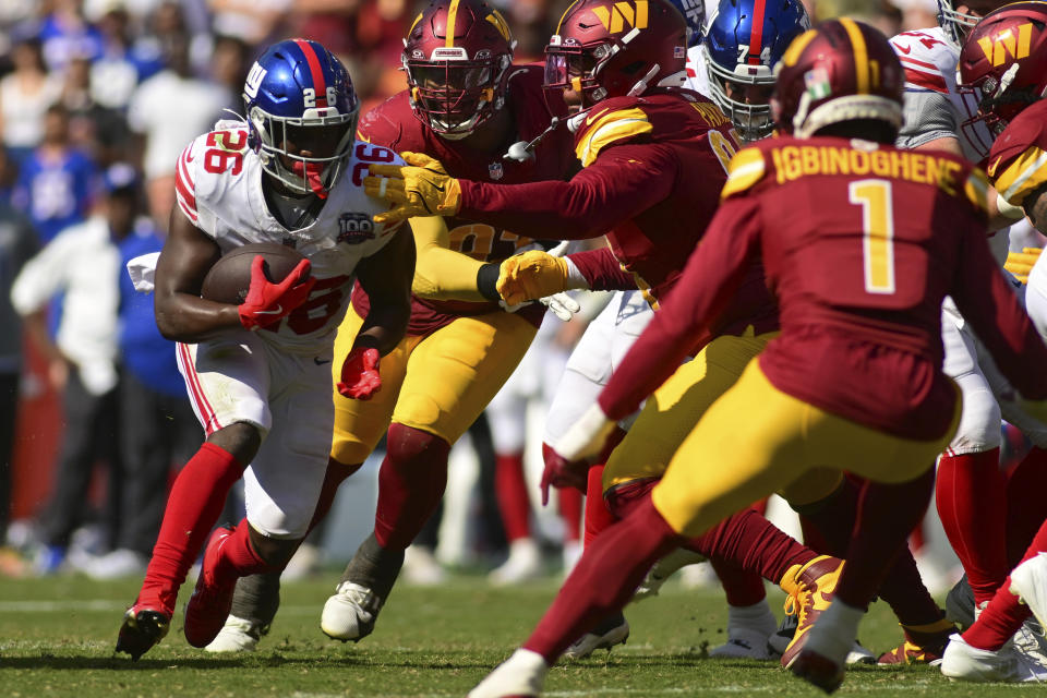 New York Giants running back Devin Singletary (26) runs against the Washington Commanders during the second half of an NFL football game in Landover, Md., Sunday, Sept. 15, 2024. (AP Photo/Steve Ruark)