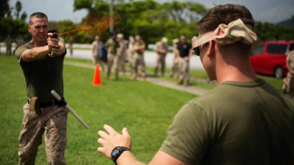 1st Lt. Keith G. Lowell administers OC spray during the OC Spray Performance Evaluation Course on Camp Hansen, Okinawa, Japan, Aug. 27, 2015. This course is part of the Non-Lethal Weapons Instructor Course, which is only offered once a year to all service members on Okinawa. The instructors for this course travel from base to base to remotely certify service members who don’t have the chance to attend the formal school in Ft. Leonard Wood, Missouri. Lowell, from Fallbrook, California, is the company commander for Company C, 3rd Law Enforcement Battalion, III Marine Expeditionary Force Headquarters Group, III MEF, and will have the collateral duty of non-lethal weapons instructor upon completion of the course.