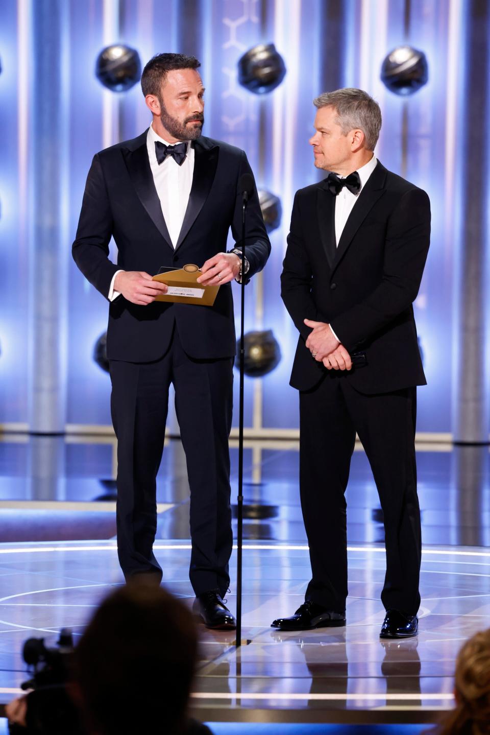 The "Air" duo of Ben Affleck and Matt Damon present at the 81st annual Golden Globe Awards.