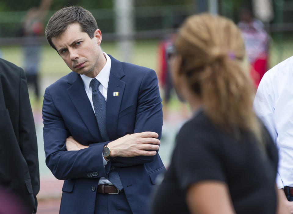 In this Wednesday, June 19, 2019 photo, South Bend Mayor and Democratic presidential candidate Pete Buttigieg listens to concerns during a gun violence memorial at the Martin Luther King Jr. Recreation Center in South Bend, Ind. (Michael Caterina/South Bend Tribune via AP)