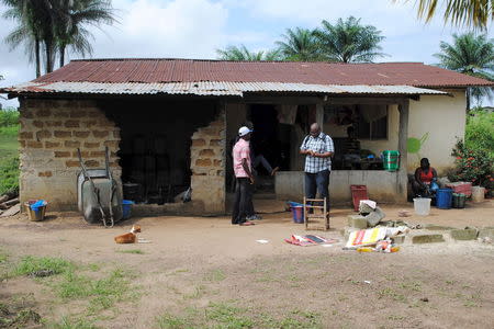 The home of 17-year-old Abraham Memaigar, one of two persons confirmed to be infected with the Ebola virus, is seen in Nedowein, Liberia, July 1, 2015. REUTERS/James Giahyue