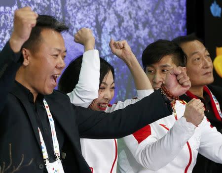 Figure Skating - ISU World Championships 2017 - Pairs Free Skating - Helsinki, Finland - 30/3/17 - Sui Wenjing and Han Cong of China and their team members react after the performance. REUTERS/Grigory Dukor