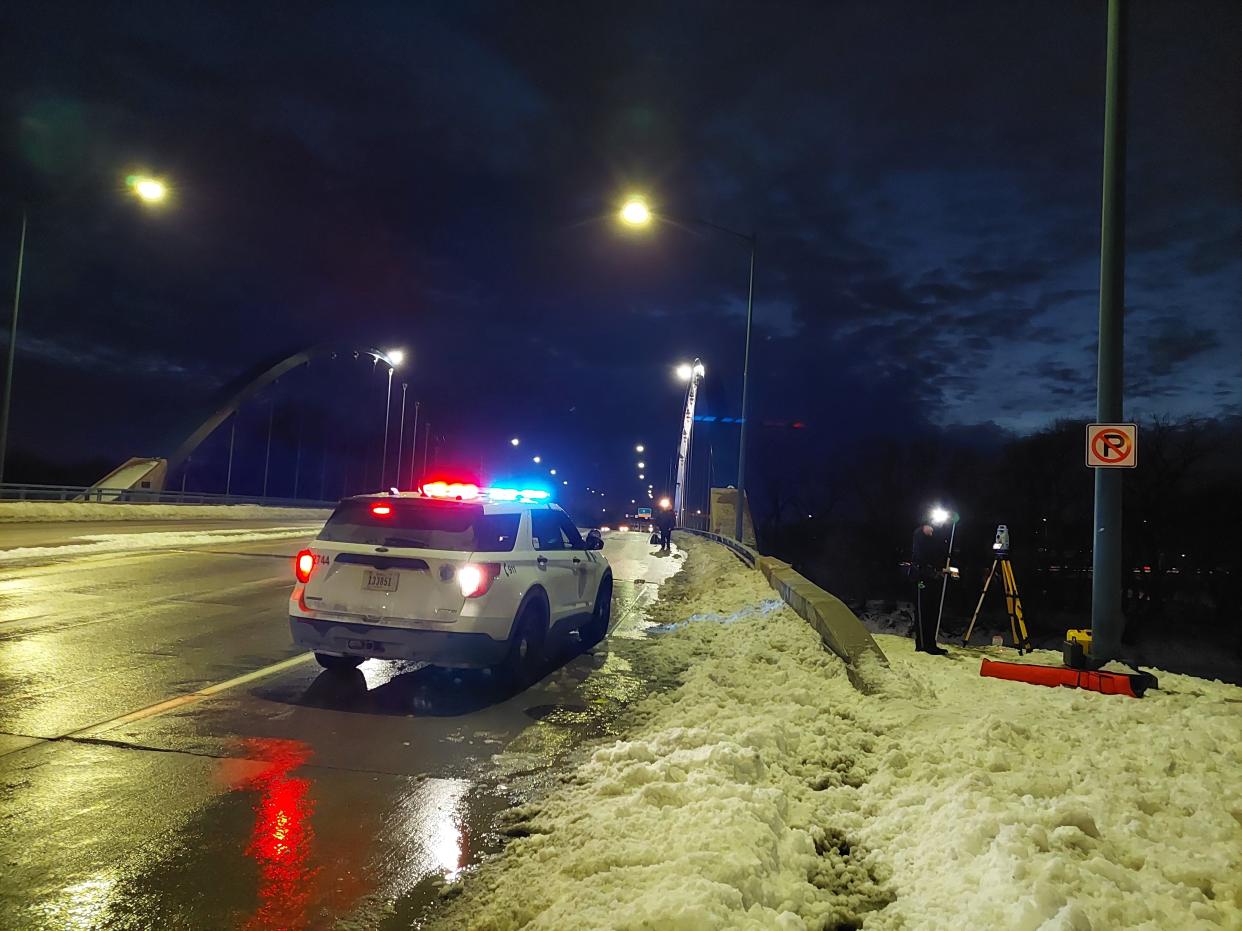 Police respond after a vehicle crashed on Martin Luther King Jr. Parkway Tuesday, Jan. 18, 2022, after a vehicle flipped over the bridge's guardrails Tuesday night.