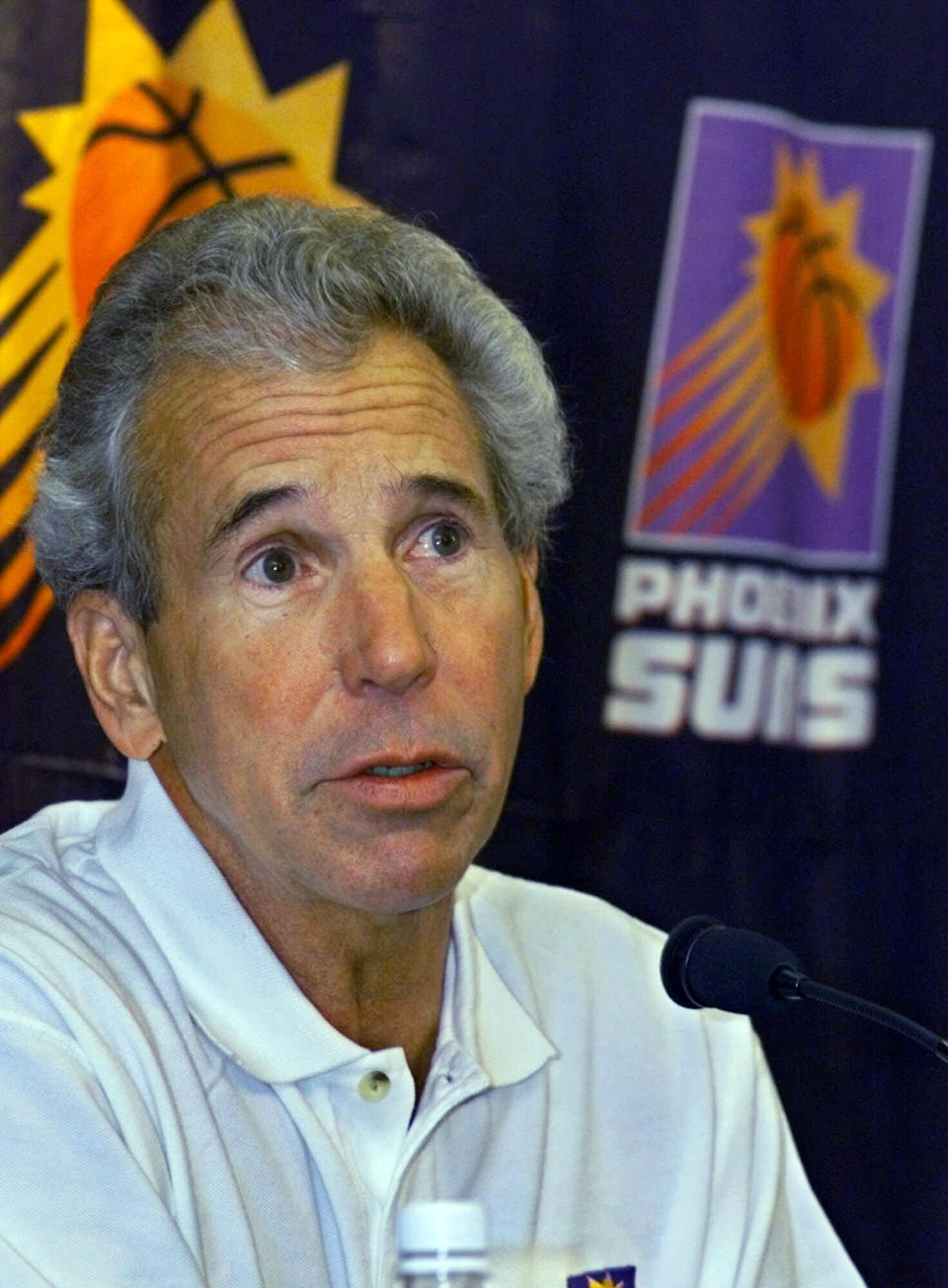 FILE - In this Saturday, Dec. 18, 1999, file photo, Phoenix Suns assistant coach John MacLeod addresses the media after being hired in Phoenix. MacLeod, the longtime NBA coach who led the Phoenix Suns to the 1976 NBA Finals, has died. He was 81. MacLeod’s son Matt confirmed his father’s death Sunday, April 14, 2019, to The Associated Press. (AP Photo/Matt York, File)