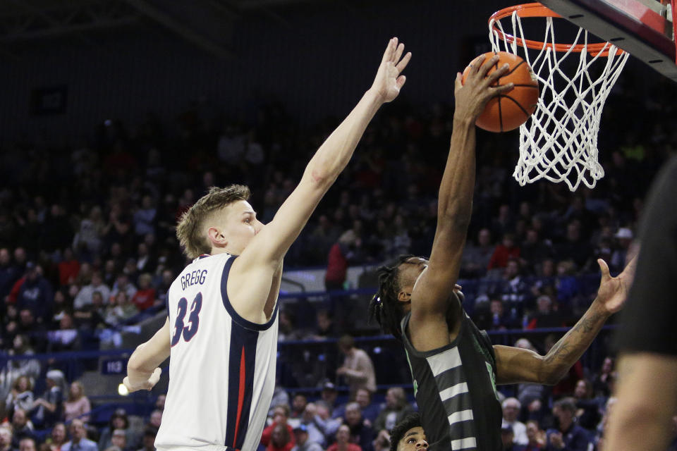 Chicago State guard Brent Davis, right, shoots next to Gonzaga forward Ben Gregg during the second half of an NCAA college basketball game, Wednesday, March 1, 2023, in Spokane, Wash. Gonzaga won 104-65. (AP Photo/Young Kwak)