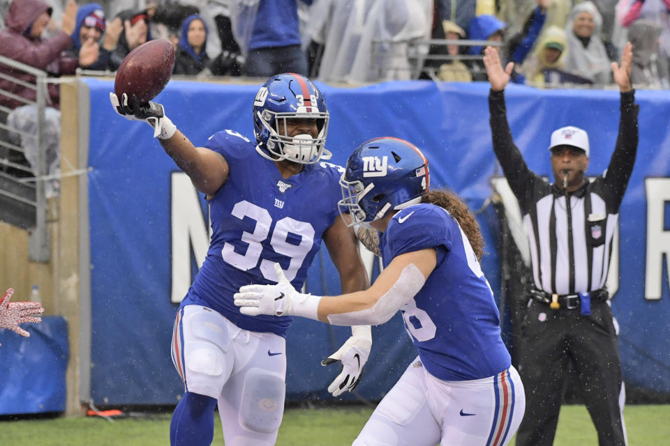 New York Giants' Elijhaa Penny, left, celebrates recovering a blocked punt for a touchdown during the first half of an NFL football game against the Arizona Cardinals, Sunday, Oct. 20, 2019, in East Rutherford, N.J. (AP Photo/Bill Kostroun)