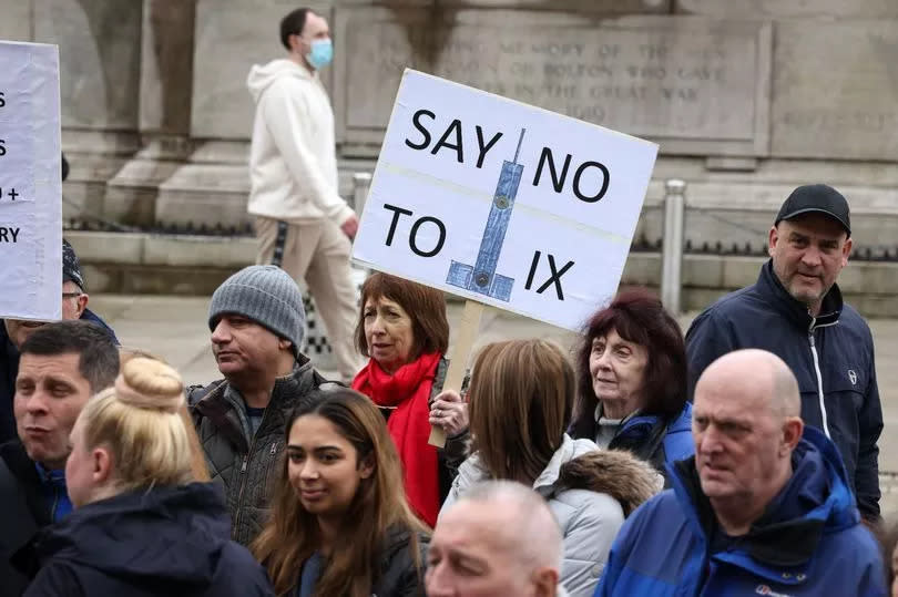 Residents in Bolton outside the town hall protesting against IX Wireless poles