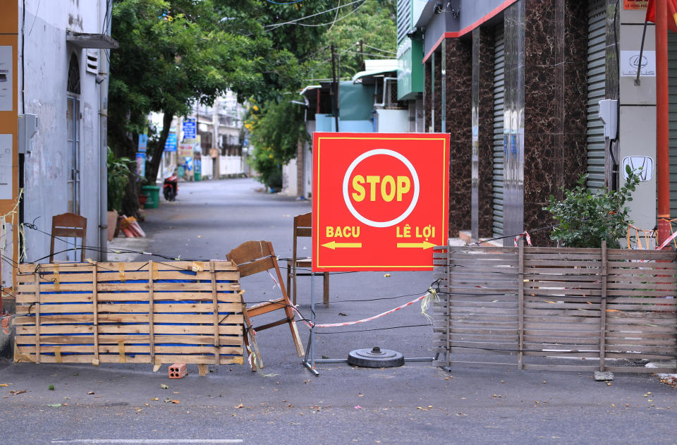 A street is blocked during a virus lockdown in Vung Tau, Vietnam on Sept. 13, 2021. More than a half of Vietnam is under a lockdown order to contain its worst virus outbreak yet.(AP Photo/Hau Dinh)