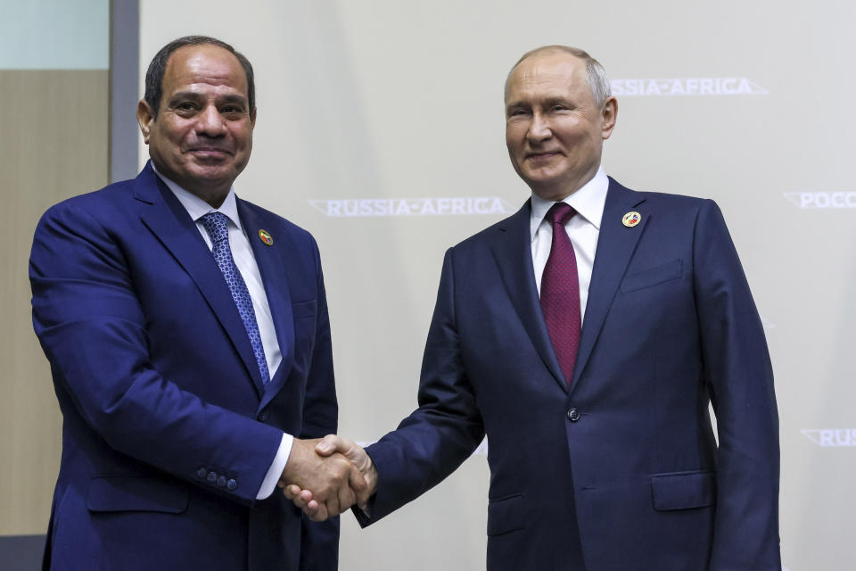 Russian President Vladimir Putin, right, and President of the Arab Republic of Egypt, Abdel Fattah El-Sisi, shake hands on the sideline of the Russia Africa Summit in St. Petersburg, Russia, Thursday, July 27, 2023. (Mikhail Metzel/TASS Host Photo Agency Pool Photo via AP)