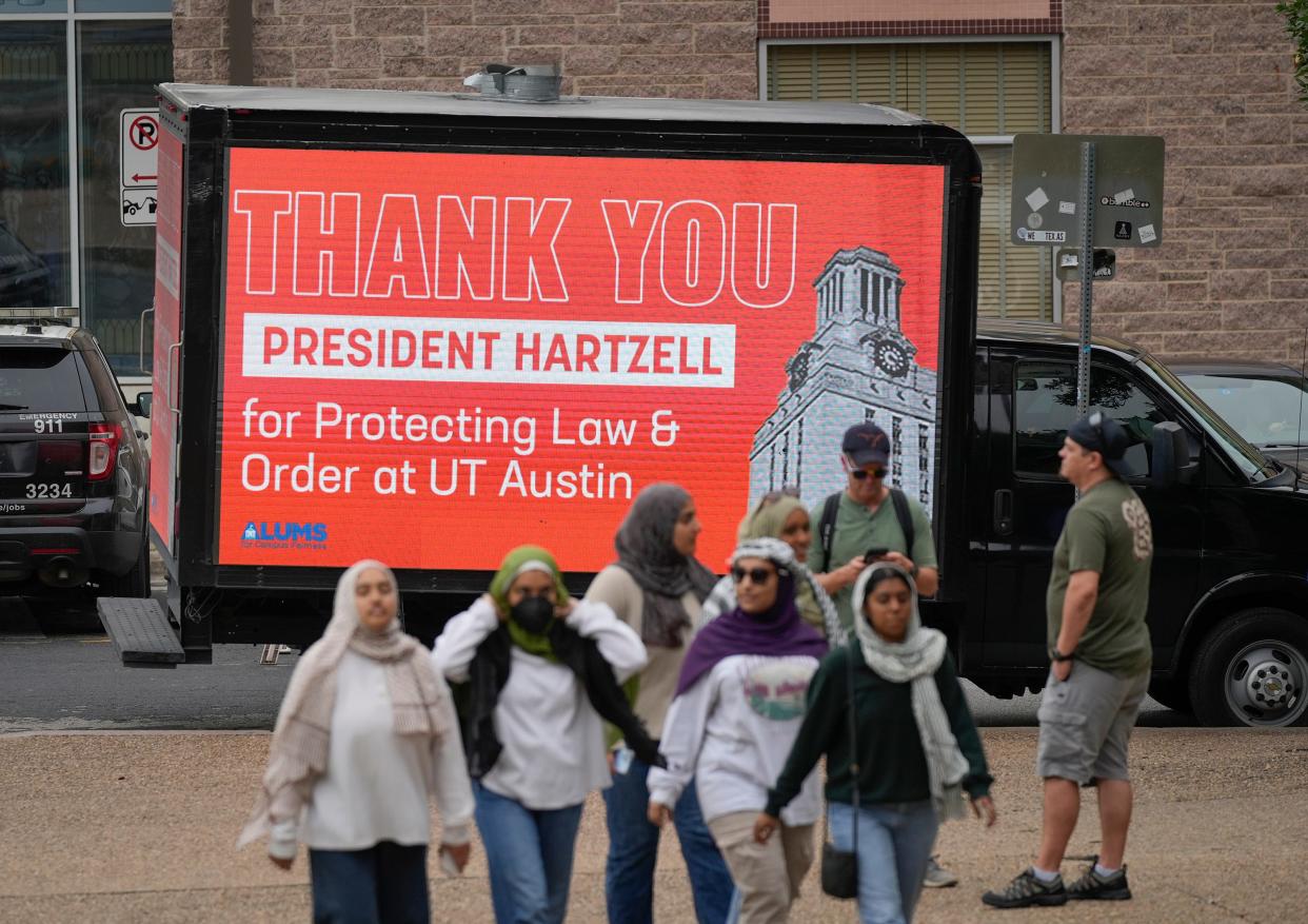 A mobile electronic billboard sponsored by Alums for Campus Fairness expresses thanks to UT President Jay Hartzell on Sunday. Hartzell said of the risk of protests at Saturday's commencement ceremony, "If it happens, it happens, and we'll deal with it and let the ceremony go on and get back to the good stuff."