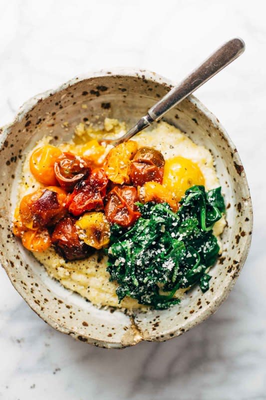 <p>Pinch of Yum</p><p>Roasted tomatoes with goat cheese polenta—an easy vegetarian recipe adaptable to whatever veggies you have on hand. Healthy meets comfort food!</p><p><strong>Get the recipe: <a href="https://pinchofyum.com/roasted-tomatoes-with-goat-cheese-polenta" rel="nofollow noopener" target="_blank" data-ylk="slk:Roasted Tomatoes with Goat Cheese Polenta;elm:context_link;itc:0;sec:content-canvas" class="link rapid-noclick-resp">Roasted Tomatoes with Goat Cheese Polenta</a></strong></p>