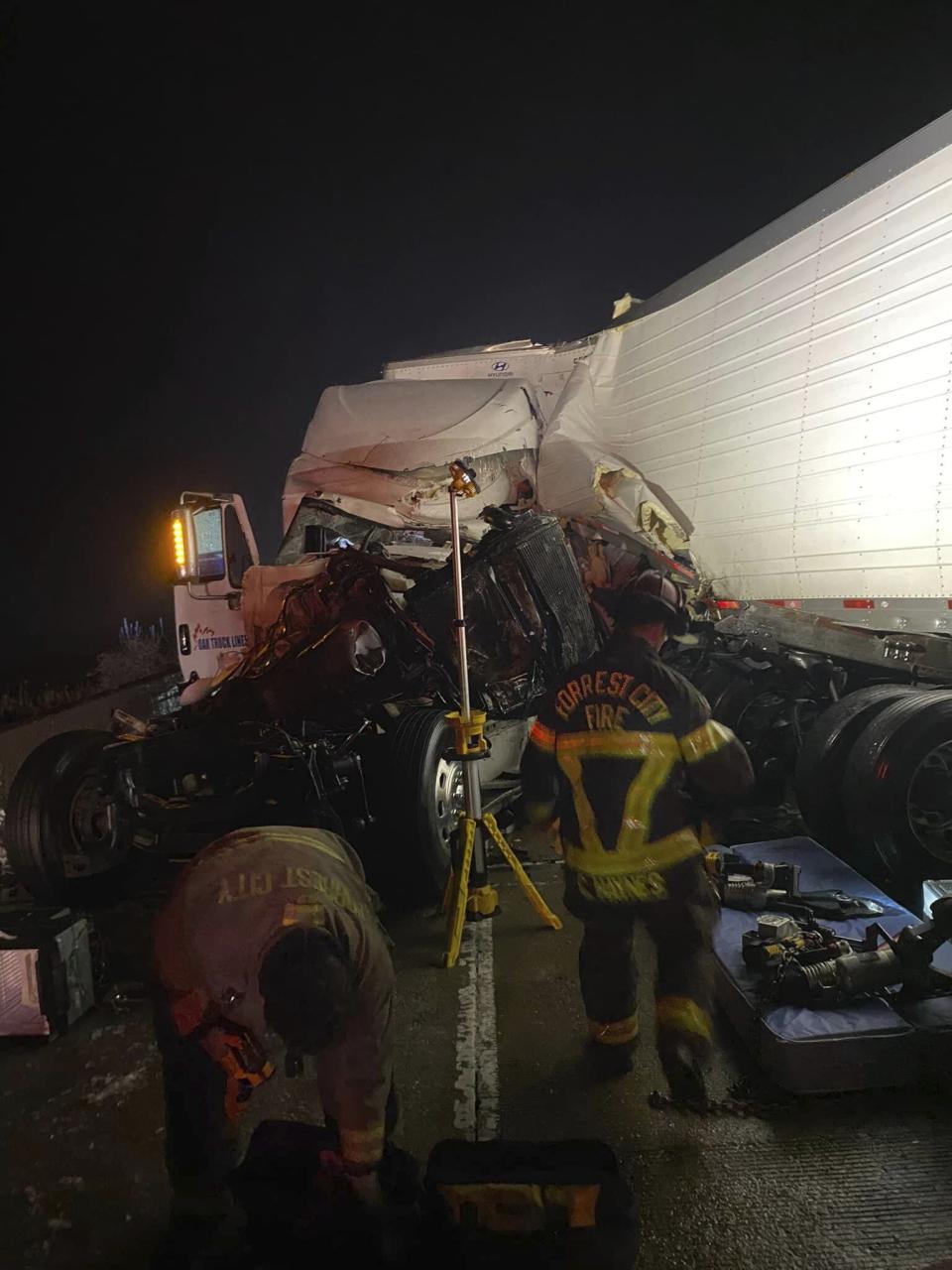 This photo provided by the Forrest City, Ark., Fire Department shows a botched tractor trailer involved in a crash on Interstate 40, at mile marker 254, about 13 miles from the Forrest City exit on Tuesday morning, Jan. 31, 2023. (Forrest City Fire Department via AP)