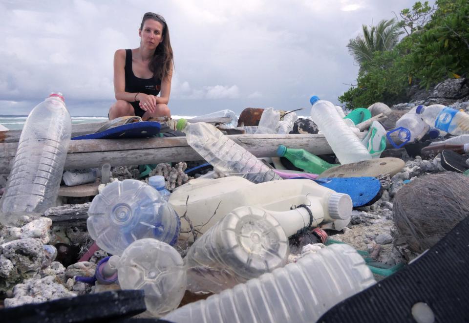 Jennifer Lavers pictured with plastic trash on the Cocos Islands. (Photo: Silke Stuckenbrock)